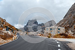 Winding road in the Dolomites to the Lagazuoi Mountains in the background of the beautiful Pelmo, Averau and Lastoi de Formin