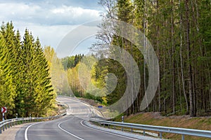 Winding road down the hill in spring