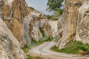 Winding road in green landscape under blue skies