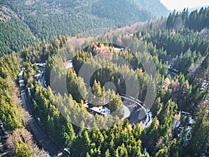 Winding road in the mountains with cars passing through