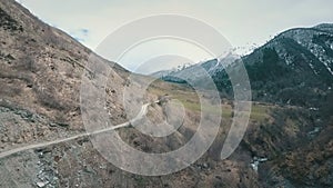 Winding road in mountains,mountains in background,shooting with the drone