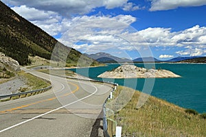 Winding Road Next to Mountain Lake