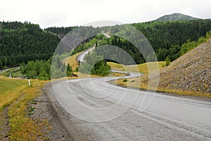 Winding road in river valley