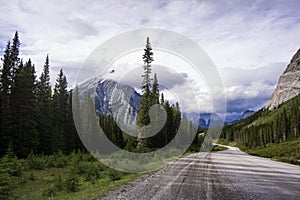 Winding Road in the Rocky Mountains with Storm Clouds