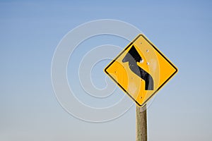 Winding road sign