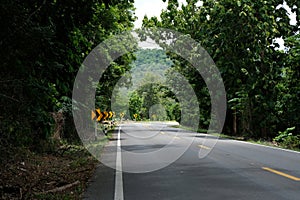 Winding road sign in the countryside