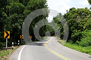 Winding road sign in the countryside