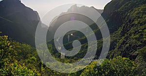 Winding road at sunset in Masca Gorge and Masca Valley Park. Tenerife, Canary Islands, Spain. Rental car. Beautiful view