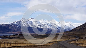 Winding road and white mountains East fjords