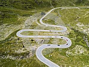 The winding roads over the Julier Pass of Swiss Alps mountains photo