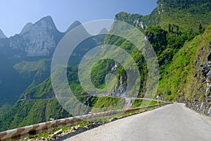 Winding roads through valleys and karst mountain scenery in the North Vietnamese region of Ha Giang / Van