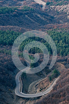 Winding roadway passes through a rural landscape.