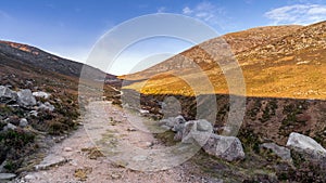 Winding trail in the valley between Slieve Donard and Rocky Mountain in Mourne Mountains