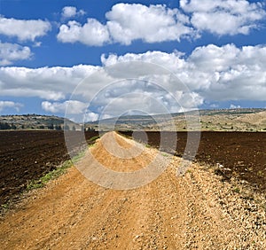 Winding white dirt road