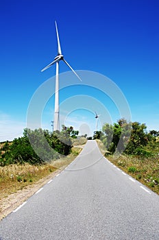 Windmil in road on the mountain, algarve photo