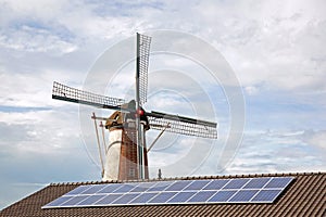 Windmil and solar panels on roof