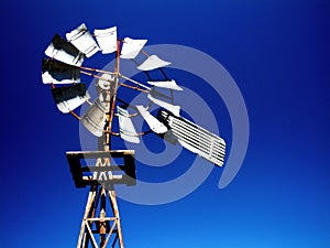 Windmill on blue sky photo