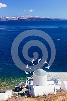 Windmill and Aegean sea from Therasia island, Santorini, Greece