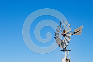 windmill against the blue sky in clear weather. copy space.