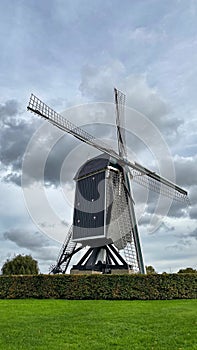 Windmill against grey skies