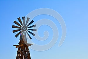 Windmill on an agricultural farm in USA.