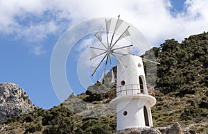 Windmill on the approach to the Lasithi Plateau in the Lasithi region of Crete. October 2017