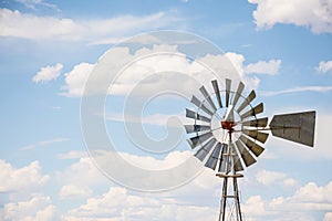 Windmill With Blue Cloudy Sky