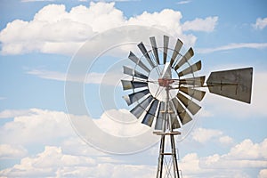 Windmill With Blue Cloudy Sky