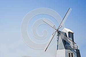 Windmill blue sky background