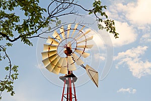 Windmill in a blue sky photo