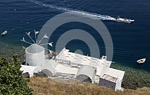 Windmill building on the island of Thirassia in Santorini, Greece photo