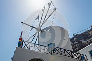 Windmill building on the island of Thirassia in Santorini, Greece photo