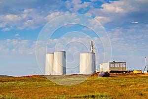 Windmill construction. Installation of wind turbine. Blue sky