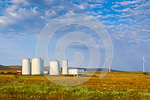 Windmill construction. Installation of wind turbine. Blue sky