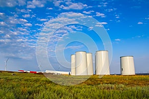 Windmill construction. Installation of wind turbine. Blue sky