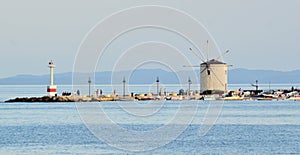 Windmill on sea wall, Corfu, Greece