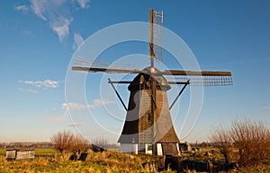 Windmill De Oude Doorn in a Dutch village