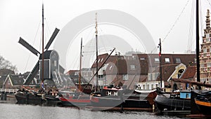 Windmill De Pu, view across Galgewater section of the Old Rhine, Leiden, Netherlands photo