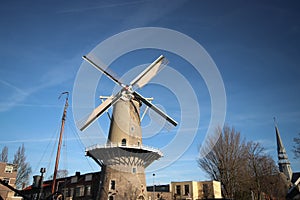 Windmill de Roode Leeuw red lion in Englisch at the turfsingel at downtown Gouda in the Netherlands. photo