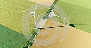 Windmill for electric power production in the agricultural fields. View from above