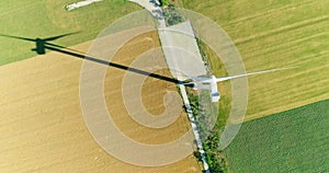 Windmill for electric power production in the agricultural fields. View from above