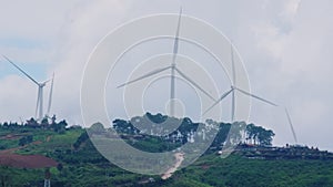 Windmill for electric power production with beautiful landscapes and blue skies