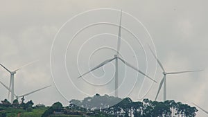 Windmill for electric power production with beautiful landscapes and blue skies