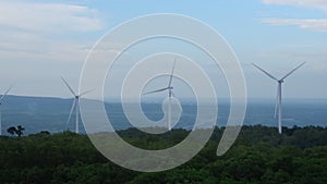 Windmill for electric power production with beautiful landscapes and blue skies