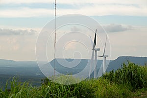 Windmill for electric power production with beautiful landscapes and blue skies to generate clean renewable green energy for