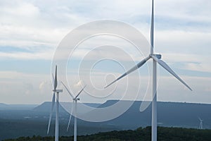 Windmill for electric power production with beautiful landscapes and blue skies to generate clean renewable green energy for