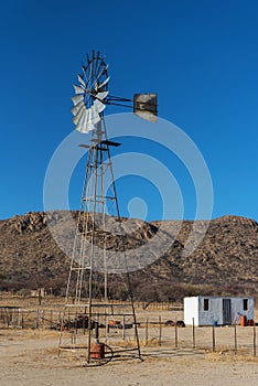 Windmill on a farm in the Erongo Mountains, Namibia
