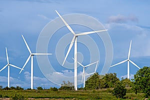 Windmill farm among fields and small trees. European Environment Initiative. Conservation of energy and fossil resources. Zero