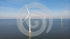 Huge windmill turbines, Offshore Windmill farm in the ocean Westermeerwind park , windmills isolated at sea on a photo