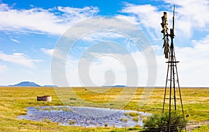 Windmill on a farm in rural grassland area of South Africa